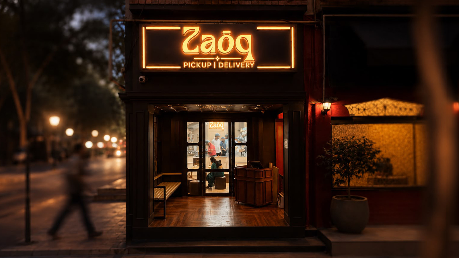The Zaōq storefront at dusk - maroon façade, brass pilasters